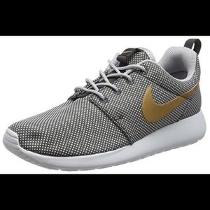 Nike women’s Roshe Run Grey w/ Gold Swoosh